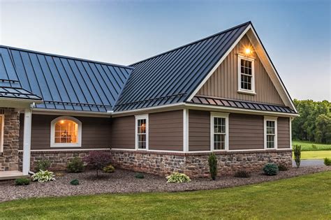 metal house with stone|metal roof on brick house.